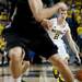Michigan freshman Spike Albrecht drives against Binghamton defenders on Tuesday. Daniel Brenner I AnnArbor.com